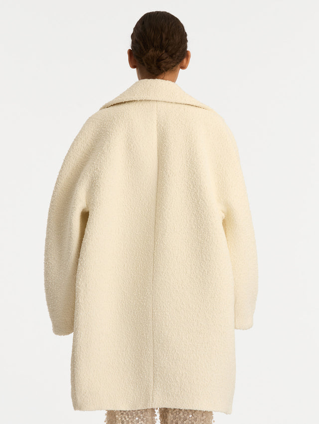 Ivory Floral Button Bouclé Tweed Coat with notched lapels, featuring two floral crystal-embellished clasps at the front. Back View.