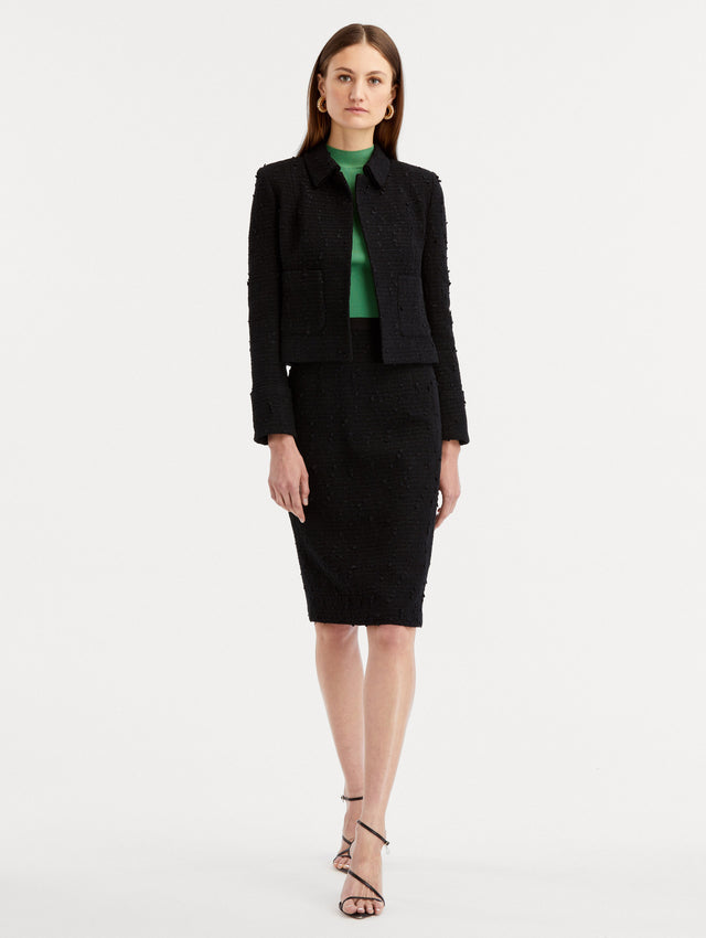 Black Boucle Tweed Jacket Styled with Tweed Black Skirt and Green Top Under Front View