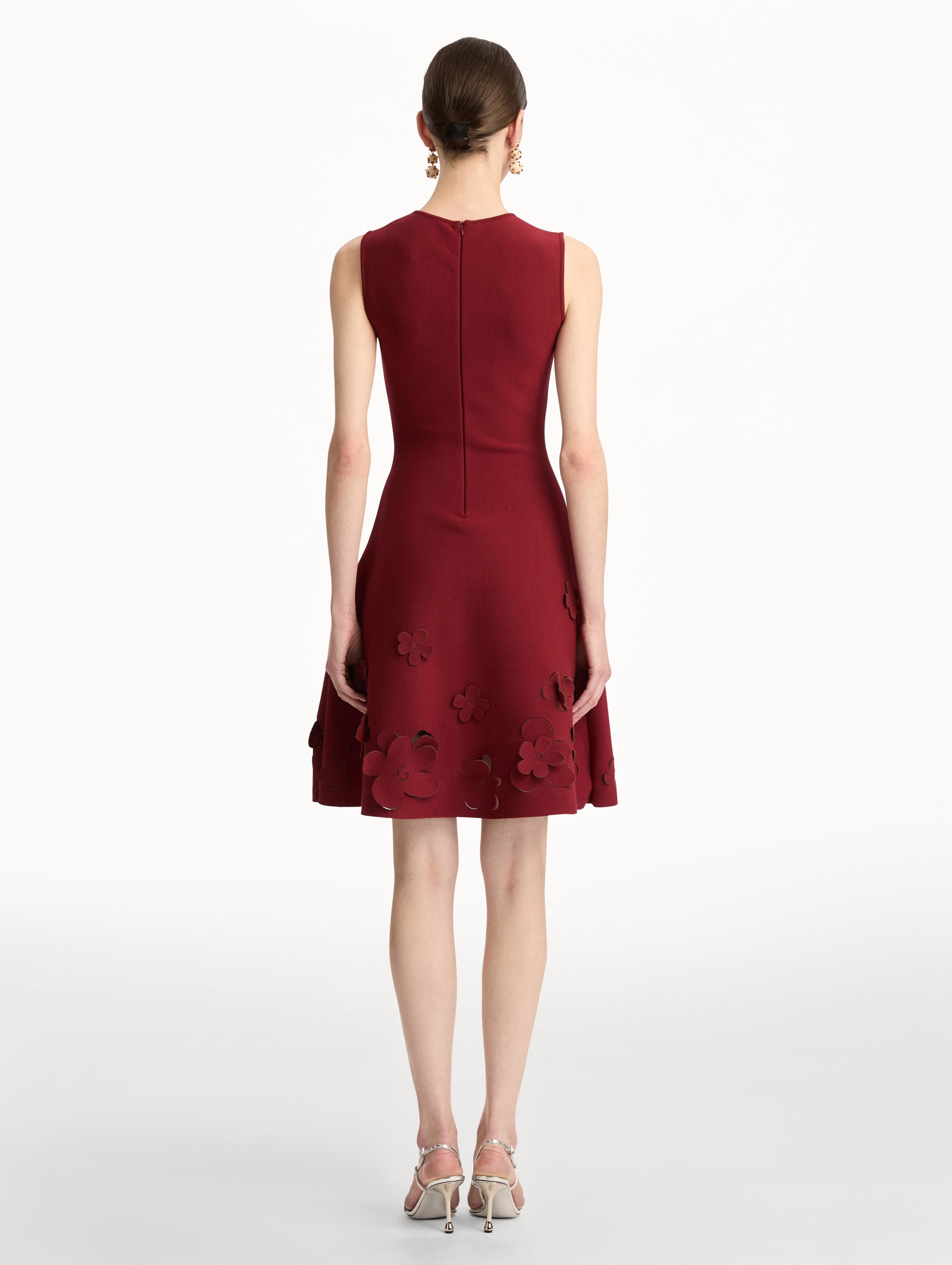 Deep red Laser-Cut Floral Knit Dress featuring a round neckline and floral cutout detailing along the hem. Back View.
