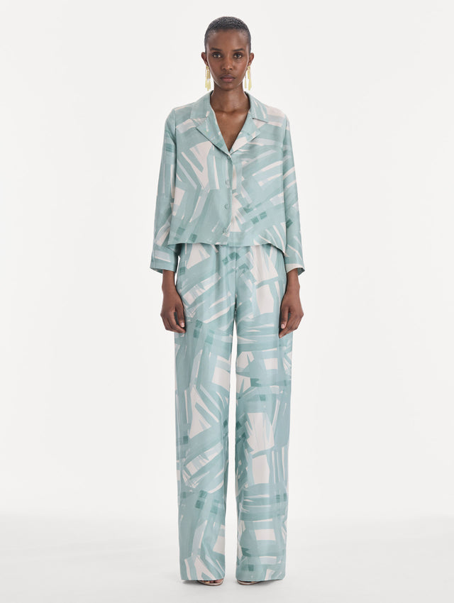 The model is wearing a long sleeve stripey plaid silk twill blouse. Front view.