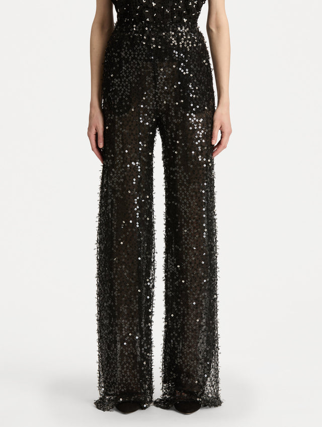 Black Floating Sequin Pant with high waist and wide leg silhouette. Front View. 
