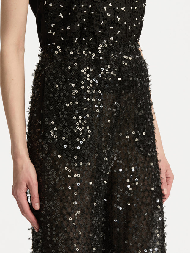 Black Floating Sequin Pant with high waist and wide leg silhouette. Zoom View. 
