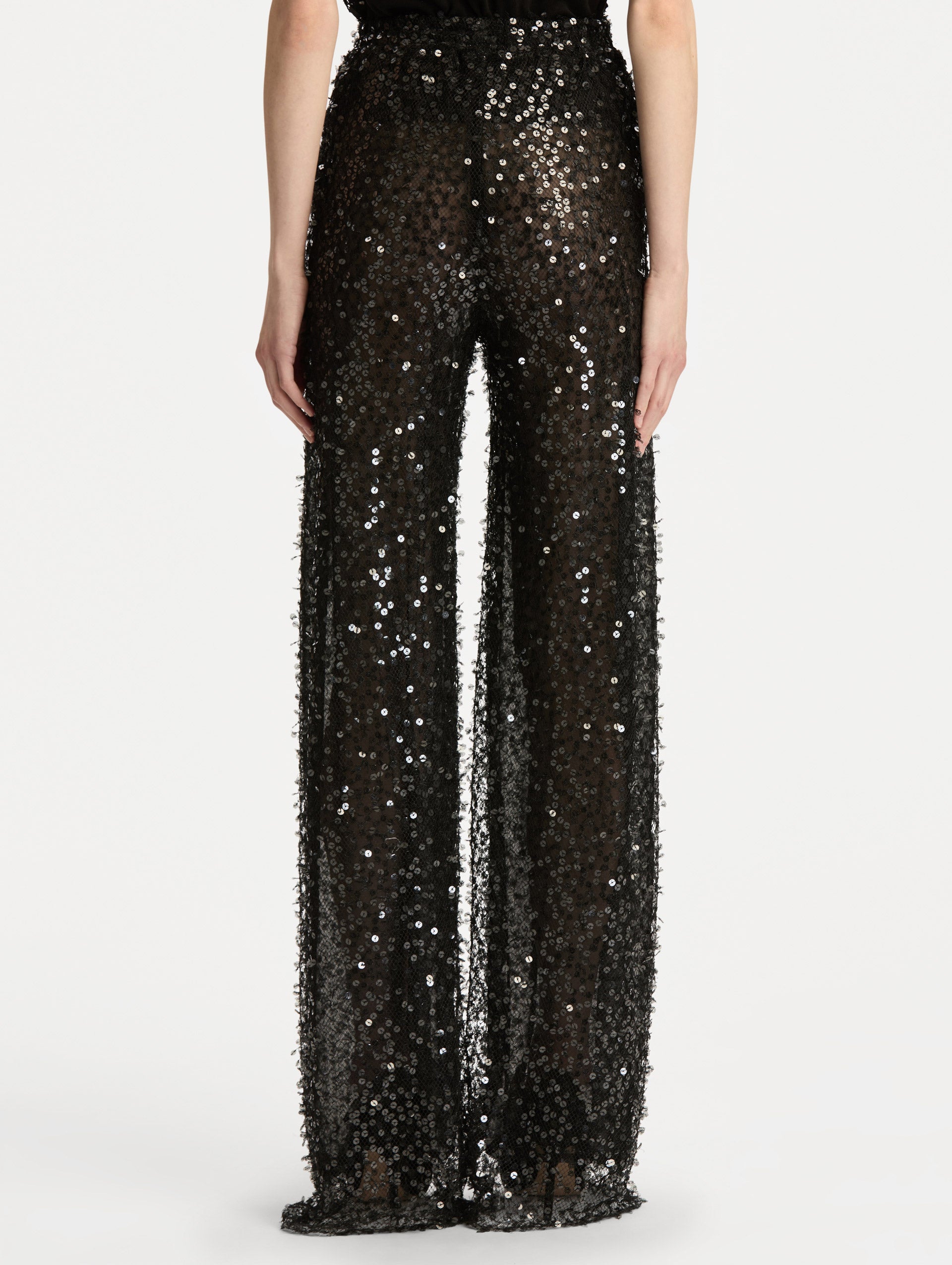 Black Floating Sequin Pant with high waist and wide leg silhouette. Back View. 