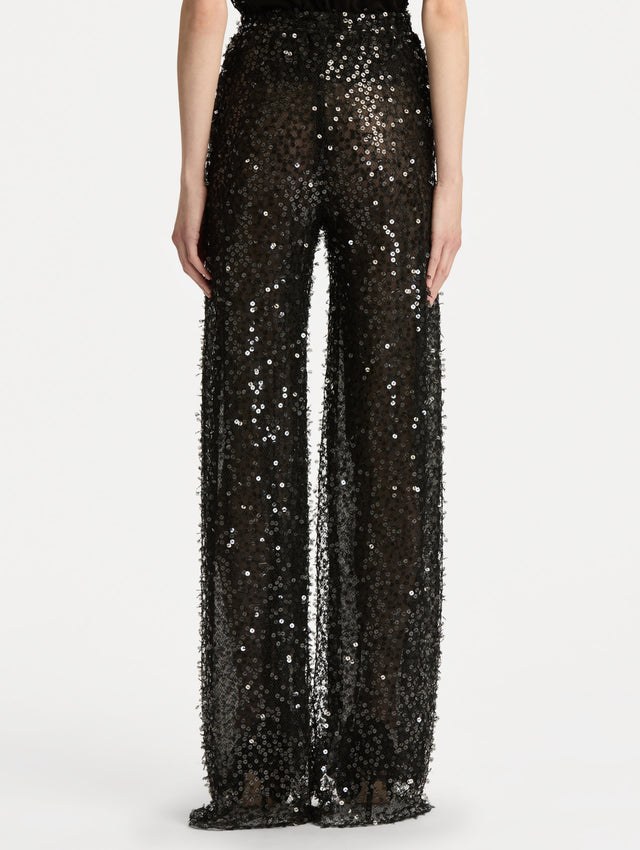 Black Floating Sequin Pant with high waist and wide leg silhouette. Back View. 