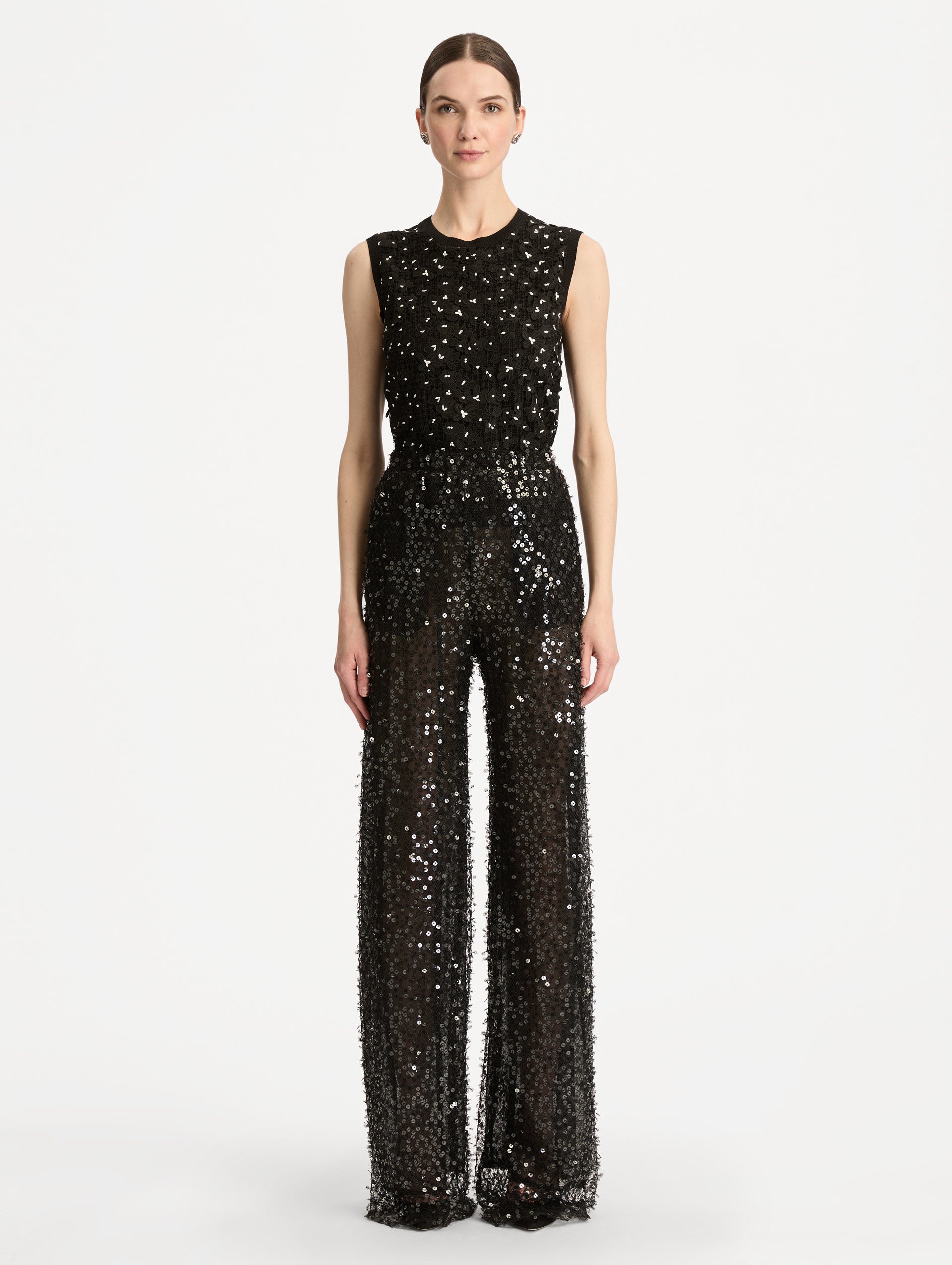 Black Floating Sequin Pant with high waist and wide leg silhouette. Front View. 