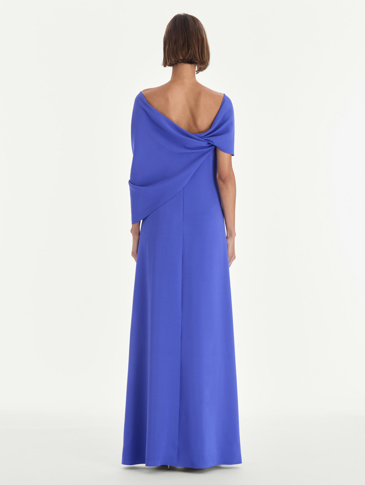 The model is wearing an off shoulder draped detail georgette caftan. Back view.