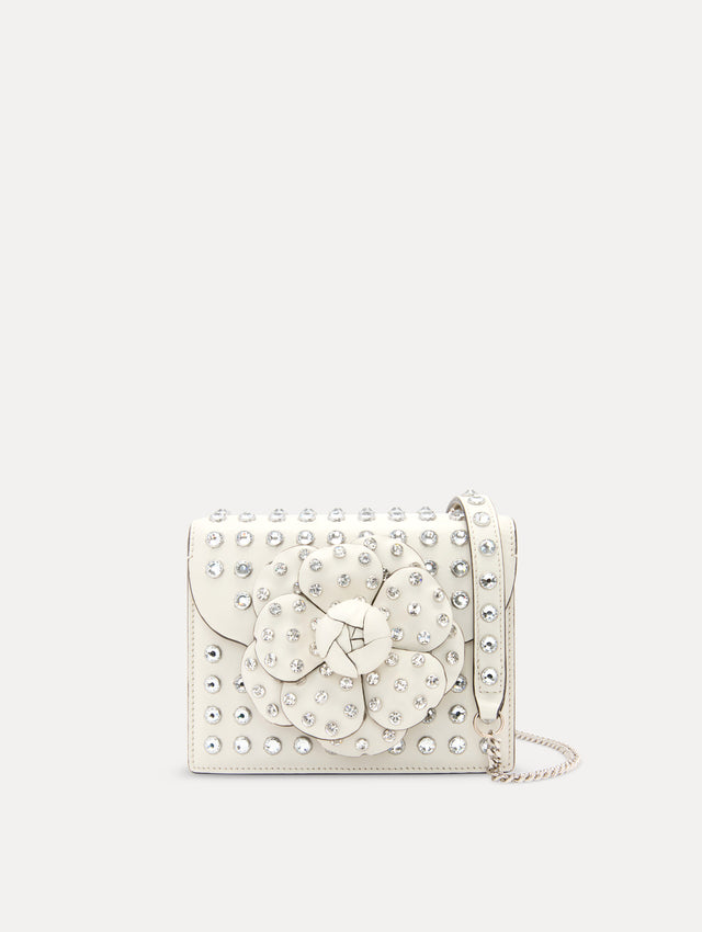 Crystal Stud Mini TRO Bag in White with Floral Applique at the Clasp and Silver Shoulder Strap Front View