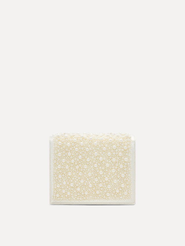 Pearl Embroidered Mini TRO Bag in White with detachable shoulder strap and flower motif at the clasp. Back View