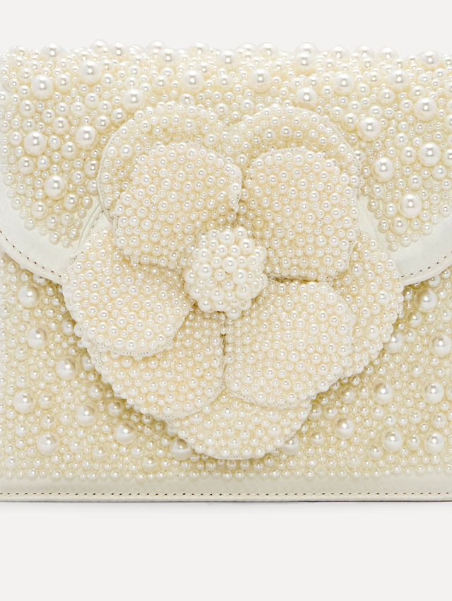 Pearl Embroidered Mini TRO Bag in White with detachable shoulder strap and flower motif at the clasp. Zoom View