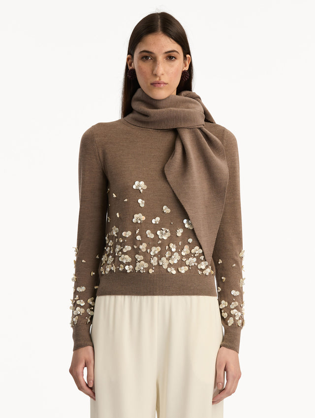 Brown Mother of Pearl Embroidered Pullover with Scarf featuring an attached draped scarf neckline and sequin floral embroidery along the hem and sleeves. Front View.