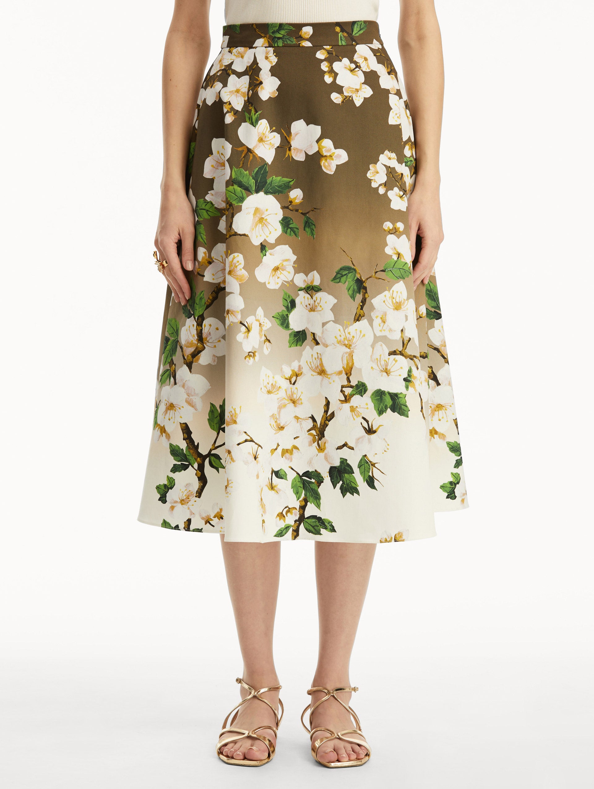 Front view of model wearing ombre khaki to white cherry blossom printed skirt.