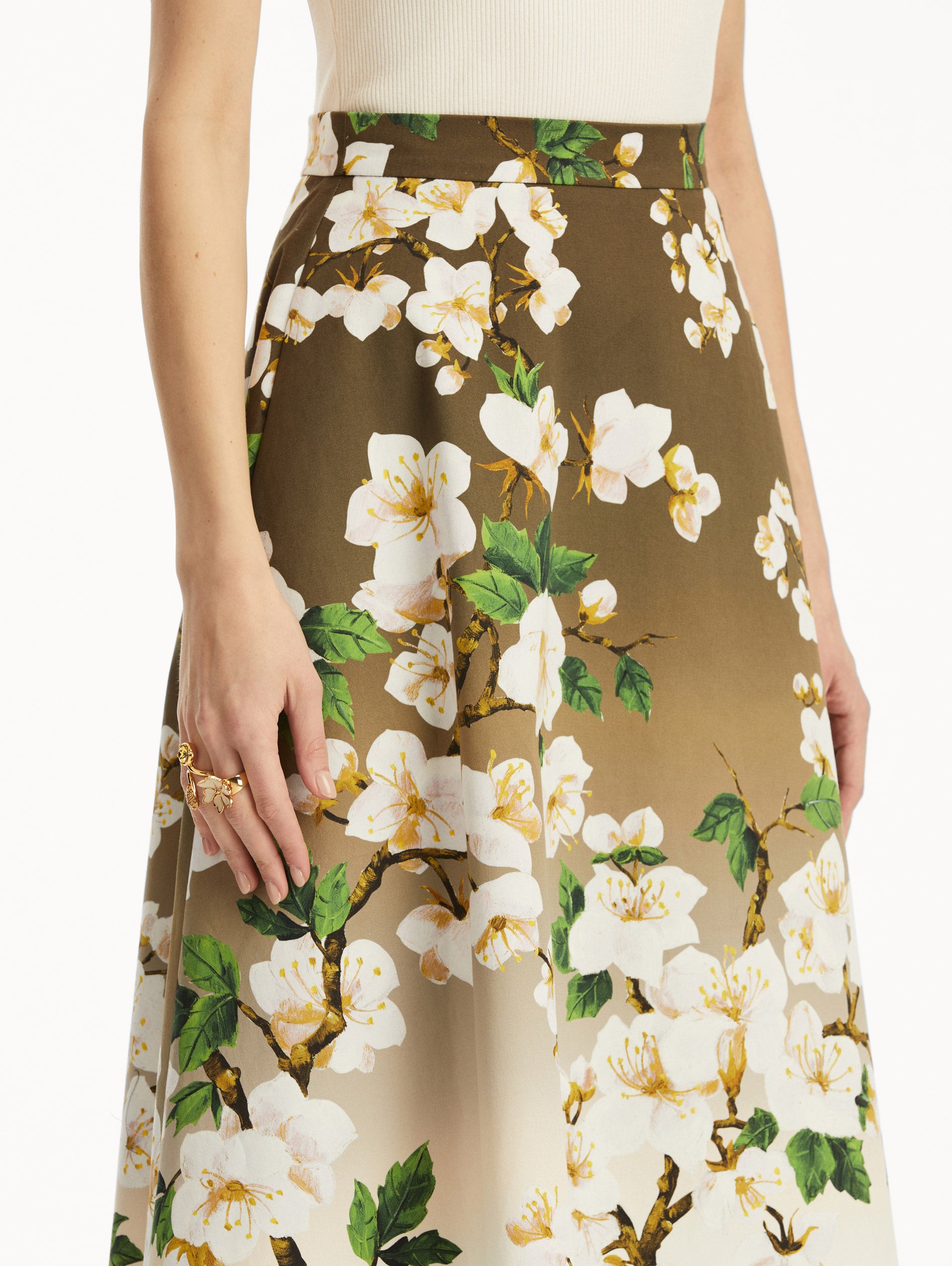 Zoomed in view of ombre khaki to white cherry blossom printed skirt.