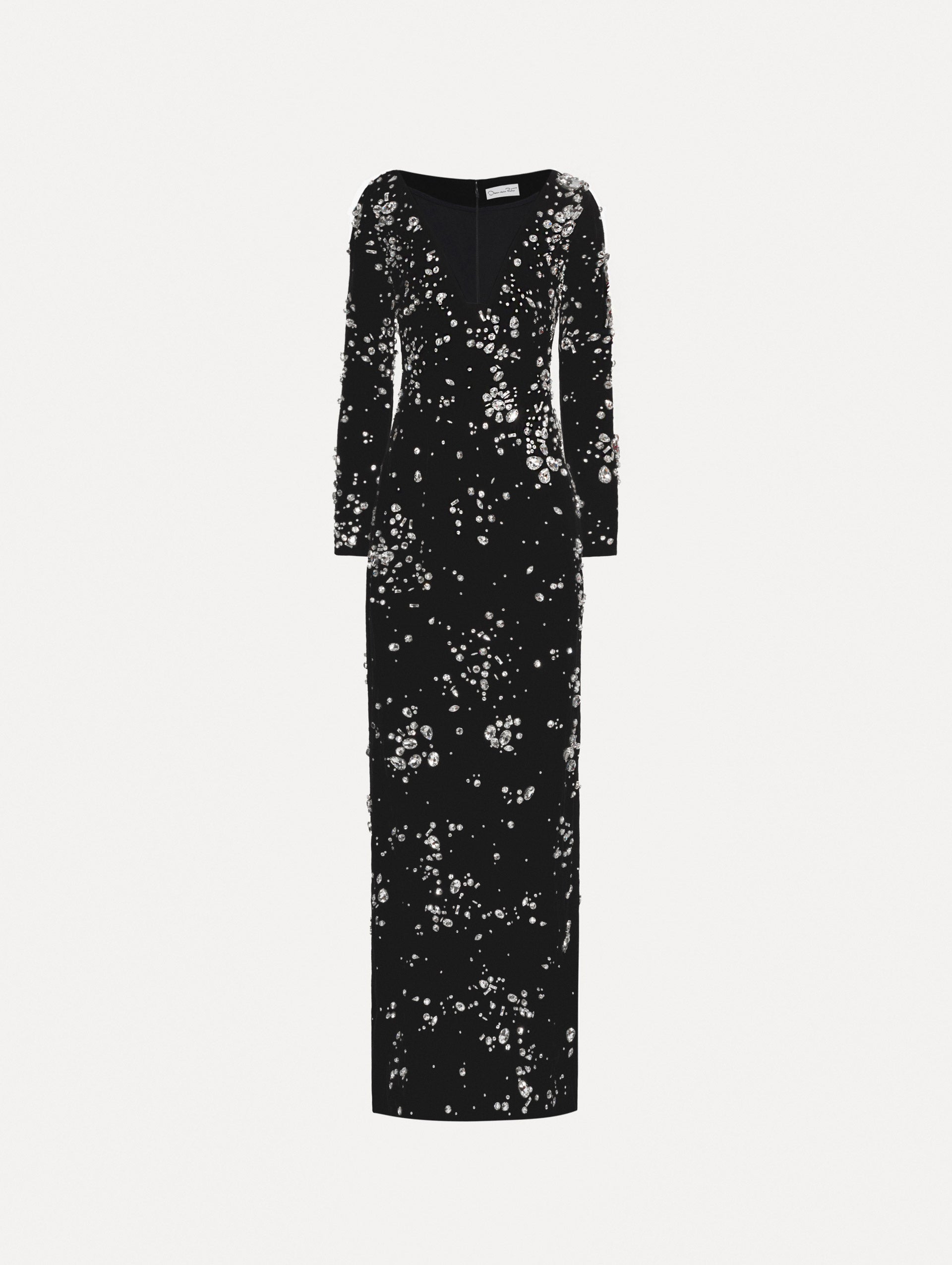 Long sleeve black gown with multi-dimensional stones scattered across the dress, features plunging V-neckline and column silhouette.