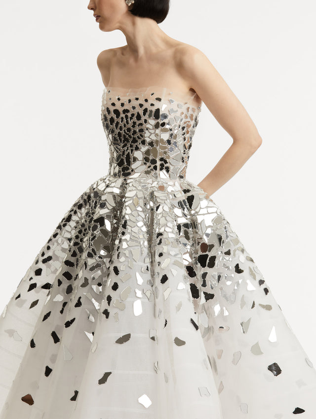 Zoomed in image of mirrored mosaic pieces fading down the dress.