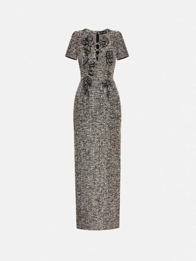 Short sleeve black and ivory tweed dress with floral appliques and lace up neckline. 