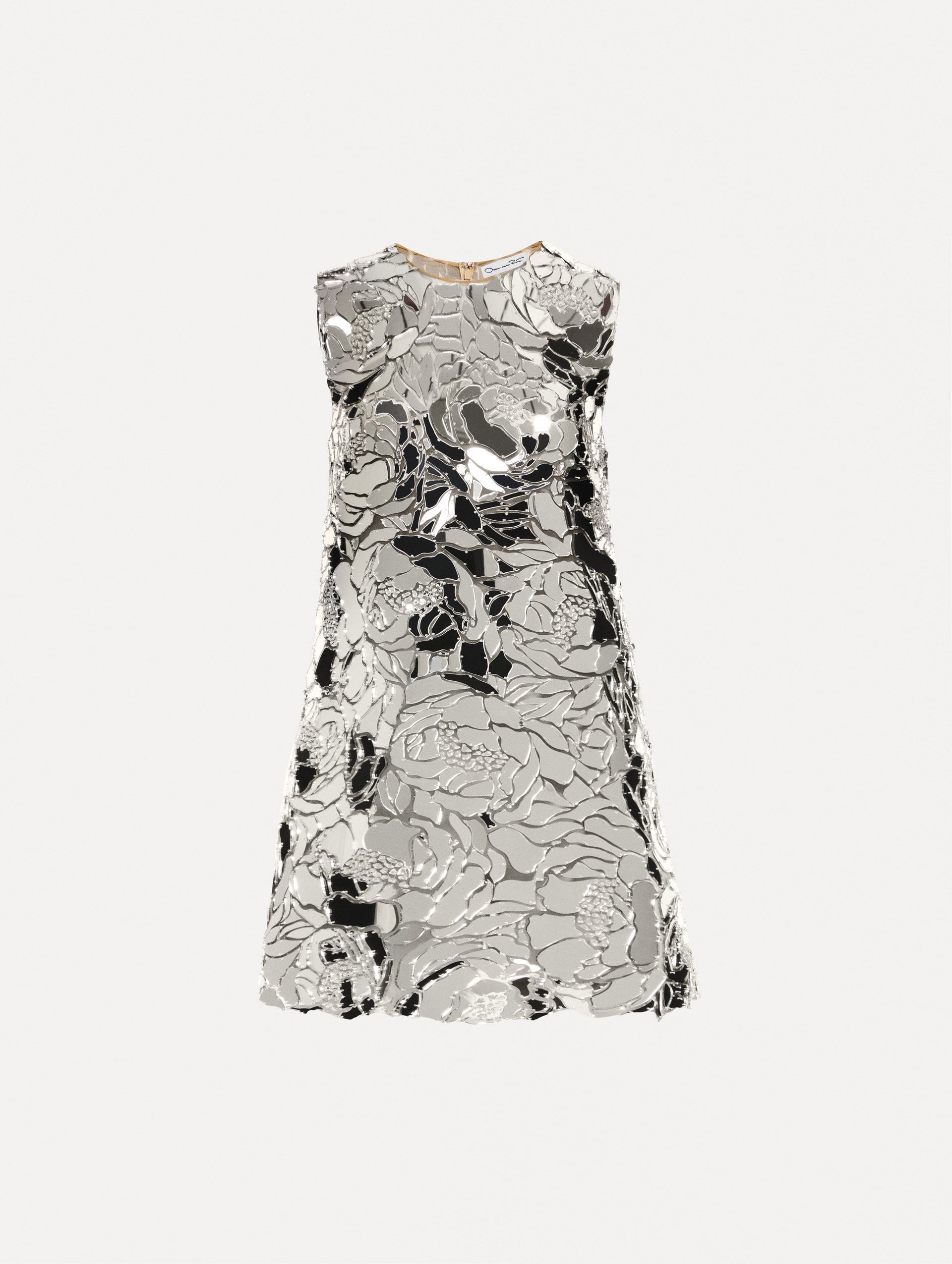 Silver shift dress composed of embroidered mirror embellishments in a floral pattern with a jewel neckline.