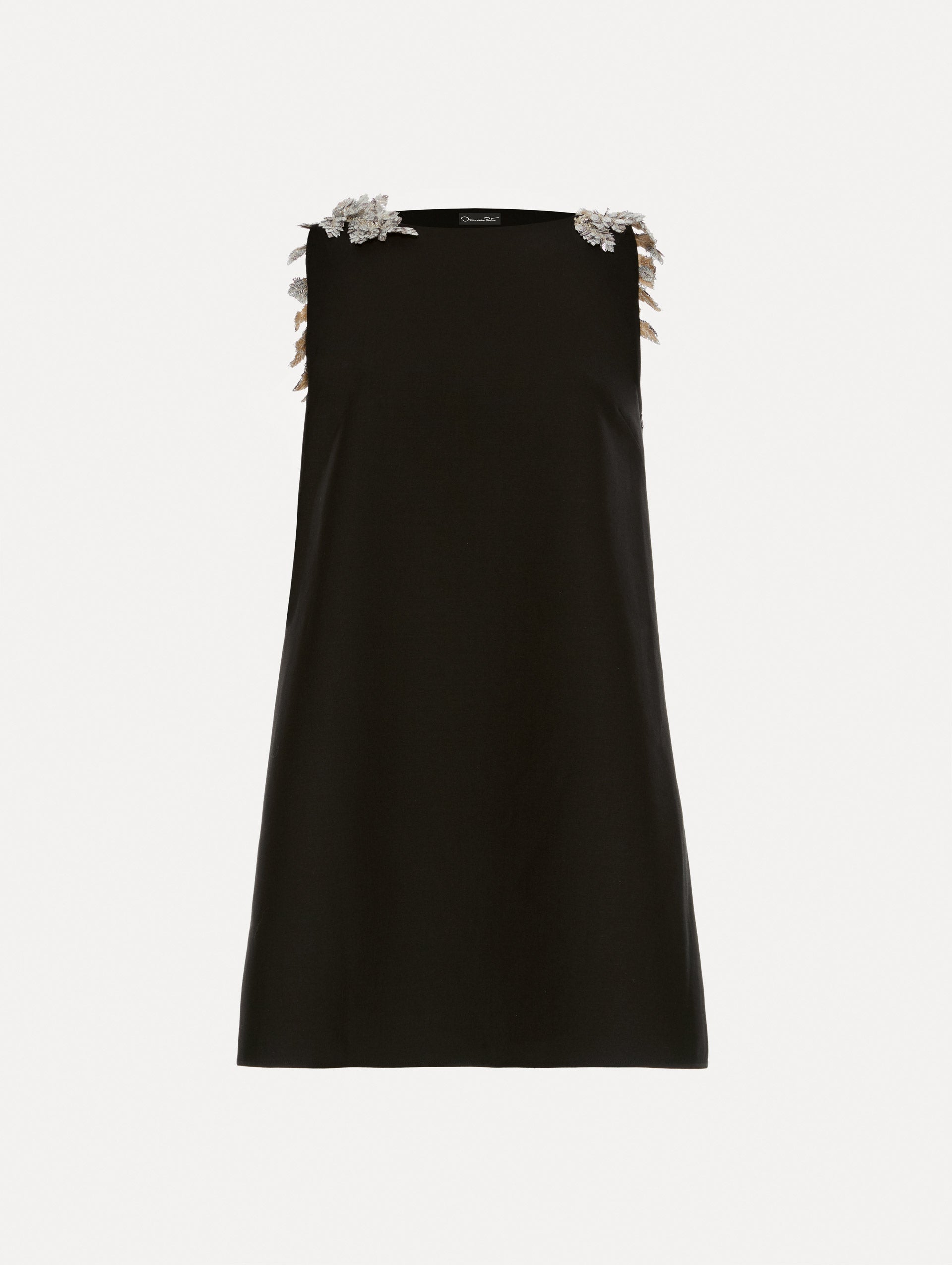 Black wool minidress in a shift silhouette that features silver sequin fern embroidery on the shoulders. 