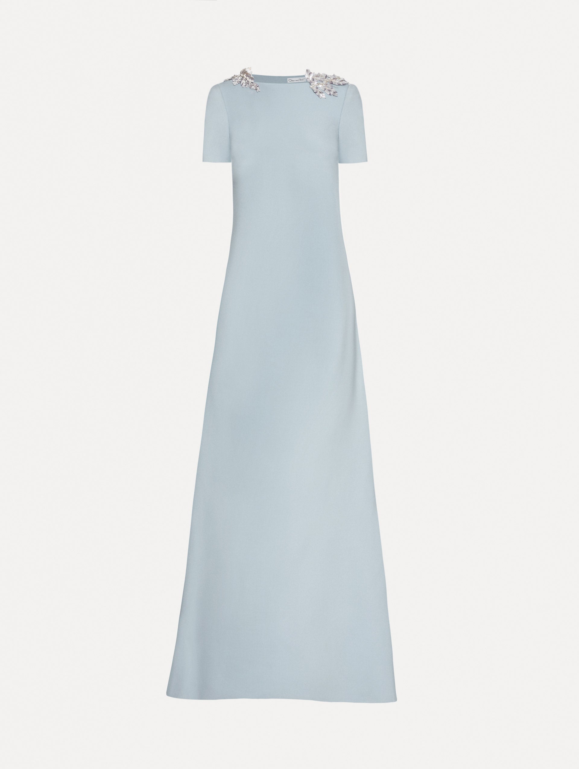 Light blue wool caftan features short sleeves with silver fern embroidery sequins on the shoulders. 