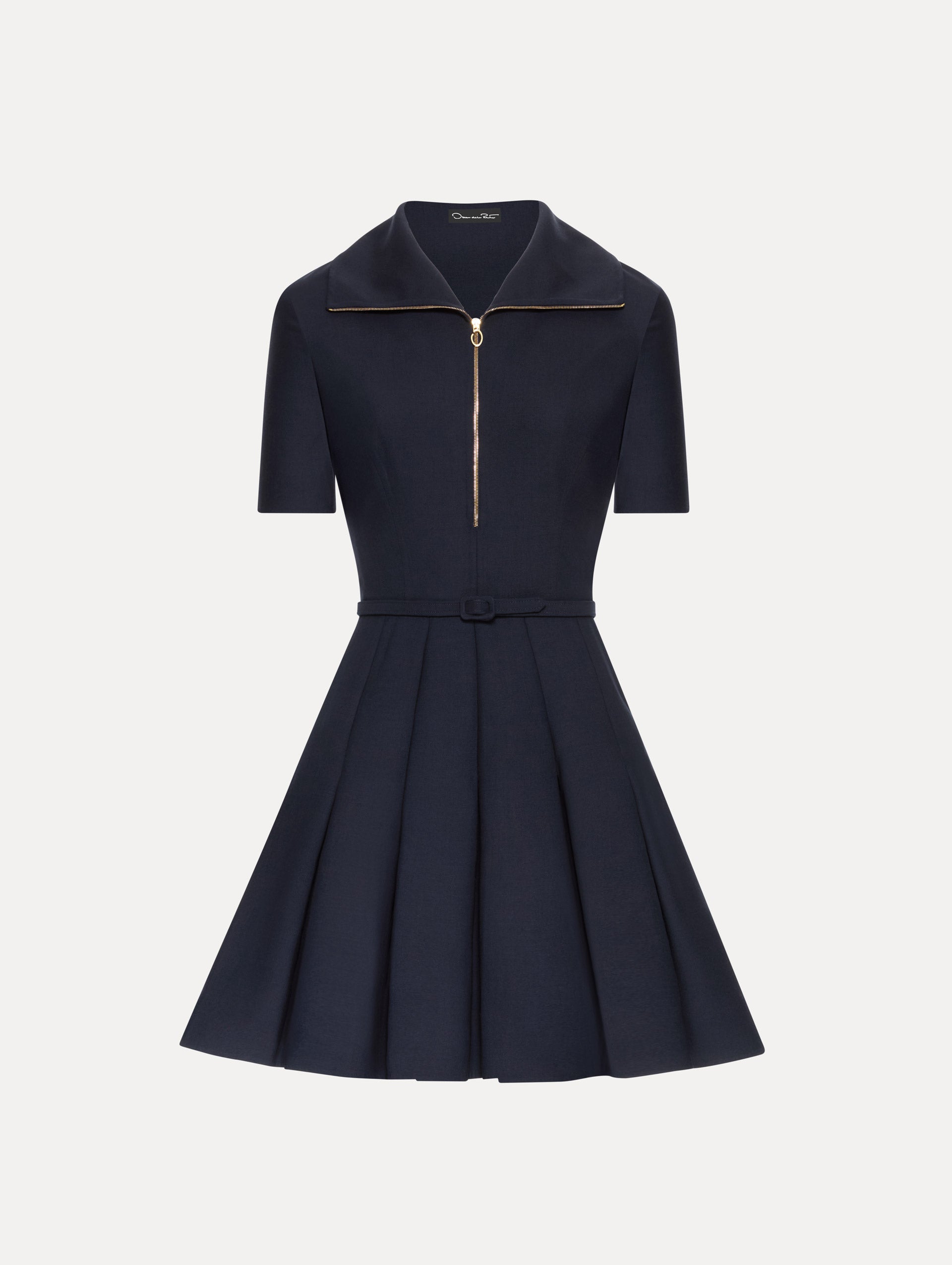 Navy short sleeve mini dress with gold zipper, spread collar, matching self-belt, and pleated skirt. 