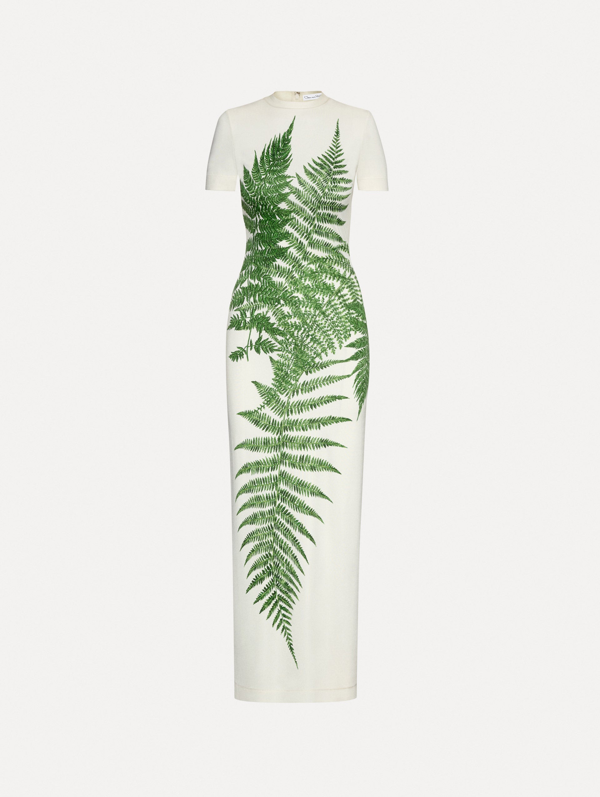 Short-sleeve jersey dress with a ivory base and green ferns concentrated at the center. 