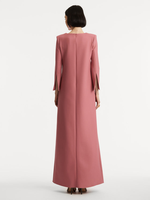 Full body back view of model wearing long sleeve pink caftan with split sleeves. 