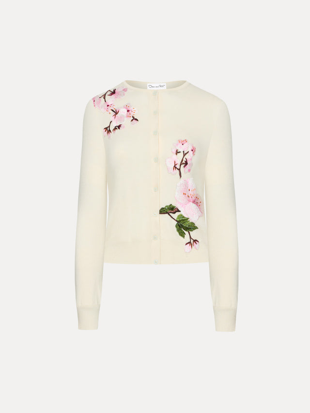 White cardigan with pink cherry blossoms embroidered. Front View
