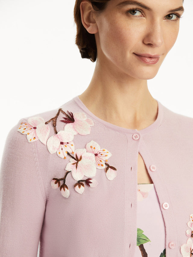 Model wearing lily cardigan with cherry blossom embroidery, paired with a cherry blossom dress. Zoom view
