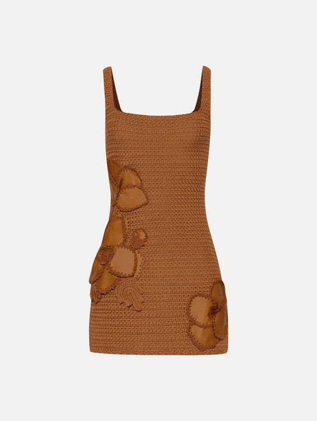 Brown sleeveless crochet mini dress with three-dimensional leather cherry blossom appliques. Front view