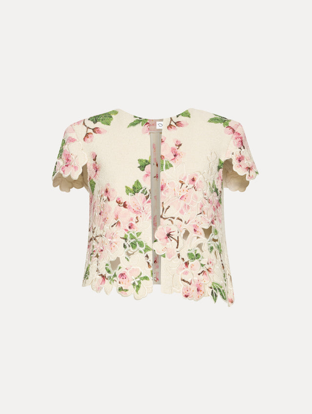 White short sleeve tweed jacket with pink cherry blossoms embroidery. Front view