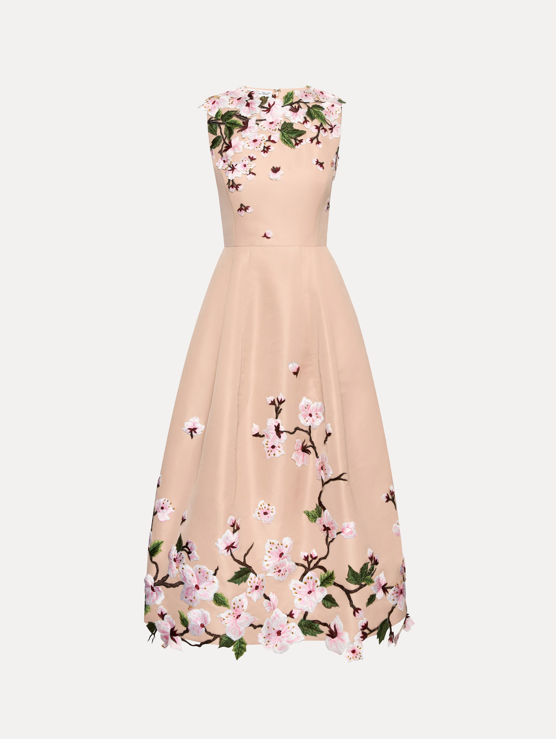 Blush pink sleeveless dress with cherry blossoms embroidered throughout the top and bottom. Front view