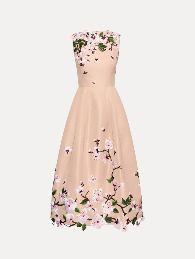Blush pink sleeveless dress with cherry blossoms embroidered throughout the top and bottom. Front view