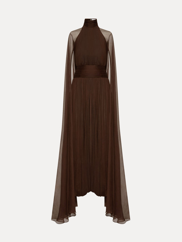 Brown chiffon gown with halter neck and long cascading sheer sleeves down the floor.