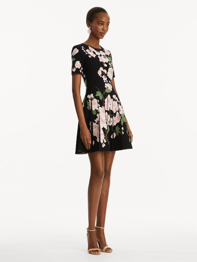 Model wearing Cherry Blossom Pleated Jacquard Dress Side View
