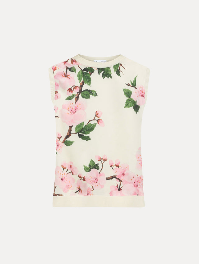 White tank with pink cherry blossoms printed.
