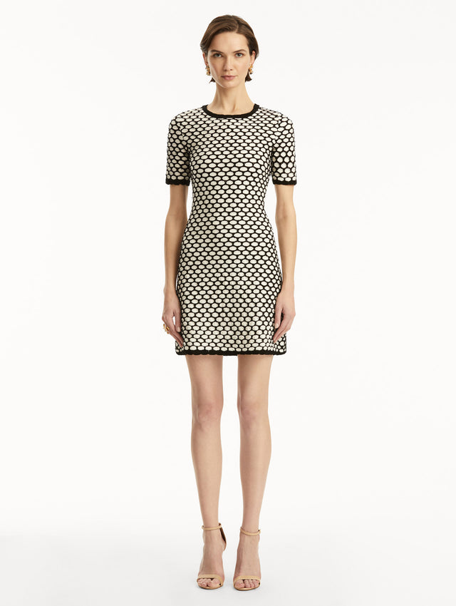 Black and white honeycomb print sequin knit short sleeve mini dress. Front view