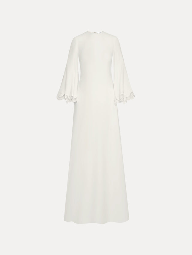 White long sleeve caftan with lace detail on the cuff of the bell sleeve. Front view.