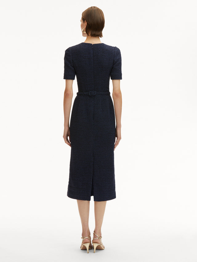 Navy Tweed Midi Dress with Short Sleeves and Round Neckline with a Matching Belt with Gold Flower Motif. Back View
