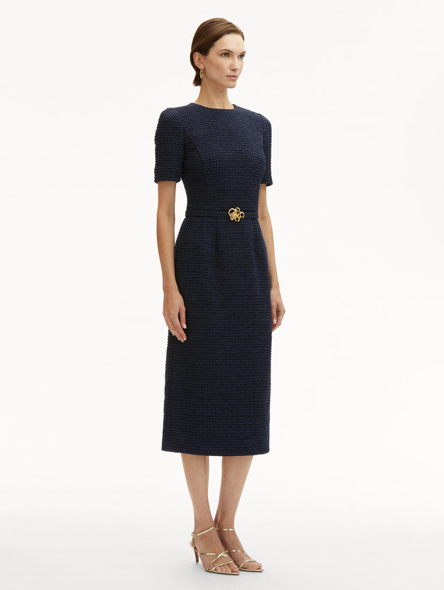 Navy Tweed Midi Dress with Short Sleeves and Round Neckline with a Matching Belt with Gold Flower Motif. Side View