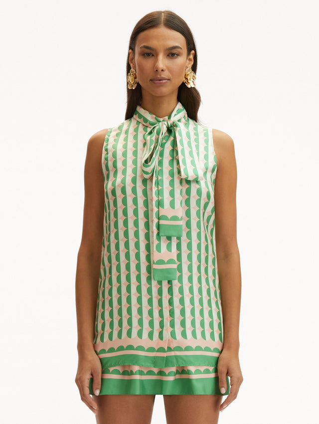 Geometric Circle Silk Twill Sleeveless Blouse that Ties in the Front with Light Pink Background and Half White Half Green Circle Print Front View