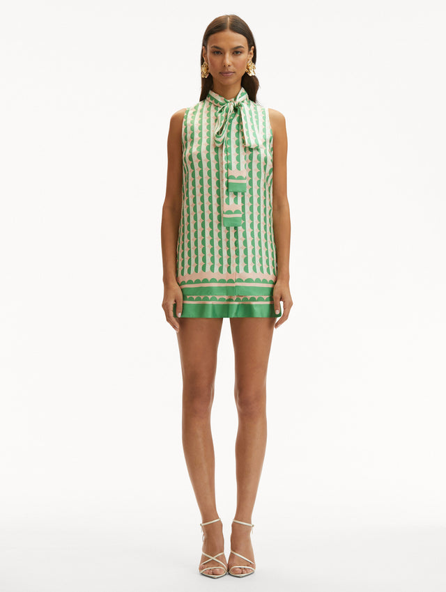 Geometric Circle Silk Twill Sleeveless Blouse that Ties in the Front with Light Pink Background and Half White Half Green Circle Print Front View