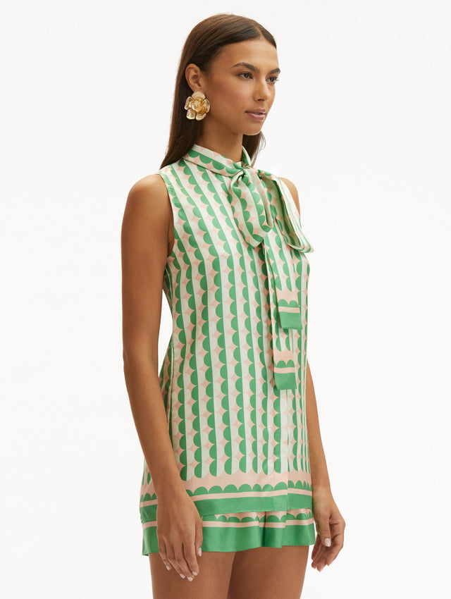 Geometric Circle Silk Twill Sleeveless Blouse that Ties in the Front with Light Pink Background and Half White Half Green Circle Print Side View