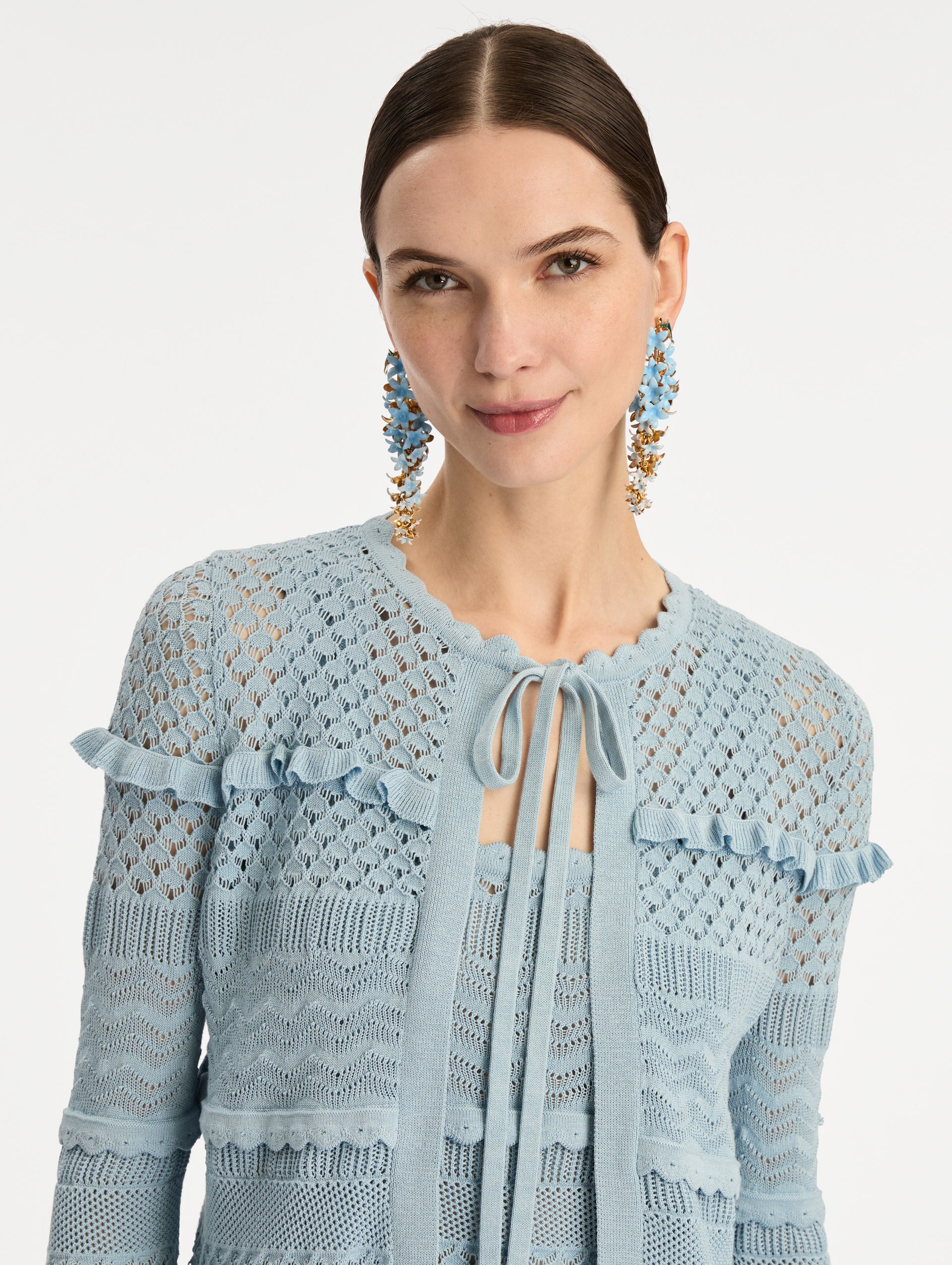 Light Blue Scallop Trim Cardigan with tie closure and textured knit patterning. Zoom View.