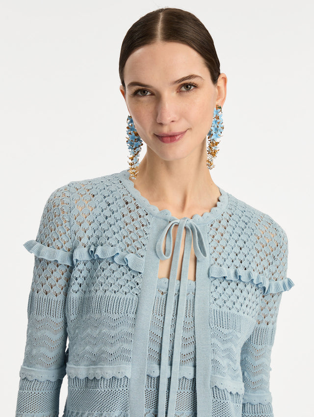 Light Blue Scallop Trim Cardigan with tie closure and textured knit patterning. Zoom View.
