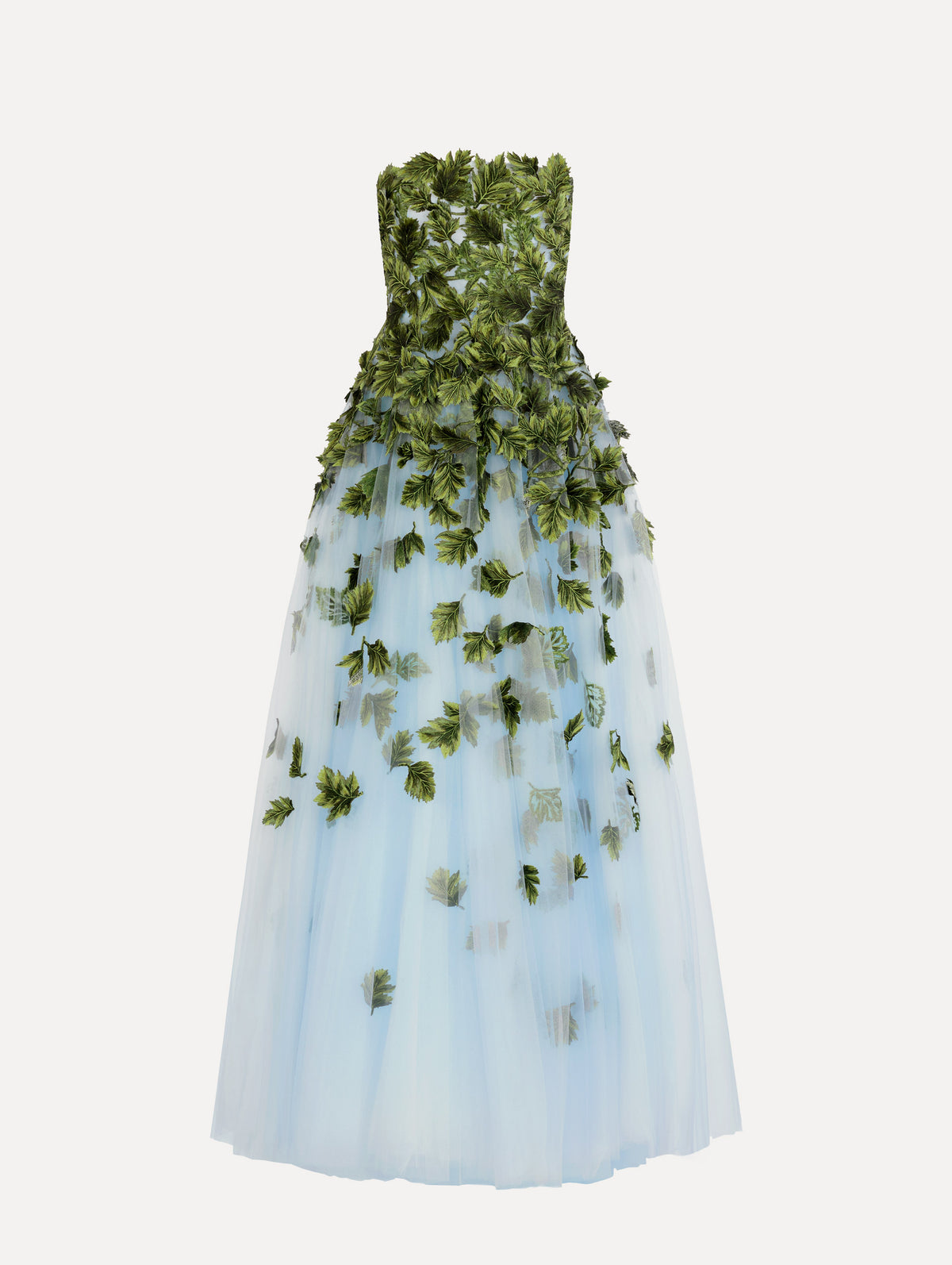The model is wearing the maple leaf appliqué gown with a strapless silhouette in the color sky blue.