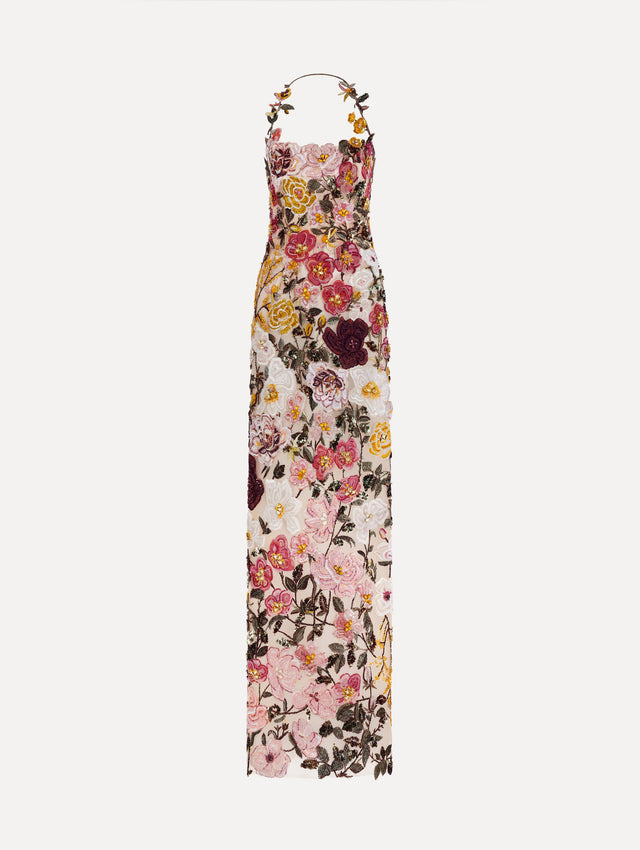 The model is wearing the beaded mixed botanical embroidered gown in multi-color with a halter neckline and floral detailing.