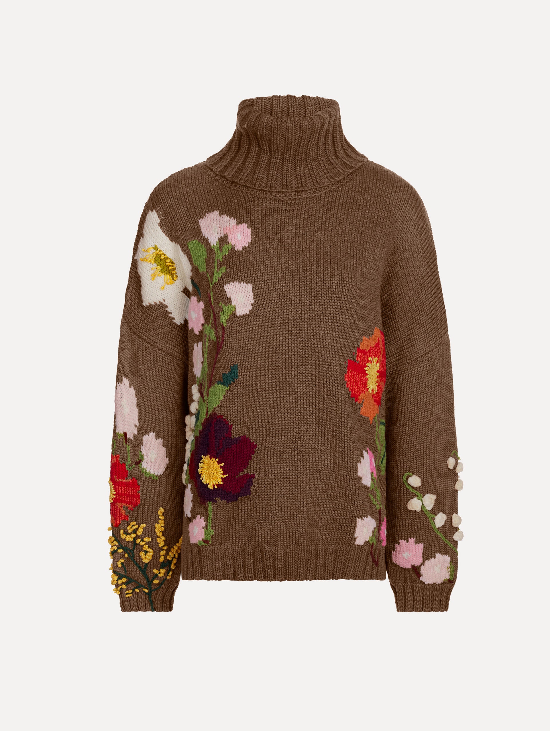 The model is wearing the mixed botanical embroidered oversized pullover with a floral intarsia pattern in the color brown. 