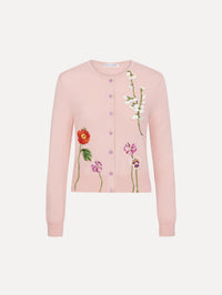 The model is wearing the mixed botanical threadwork cardigan in the color blush with floral detailing. 