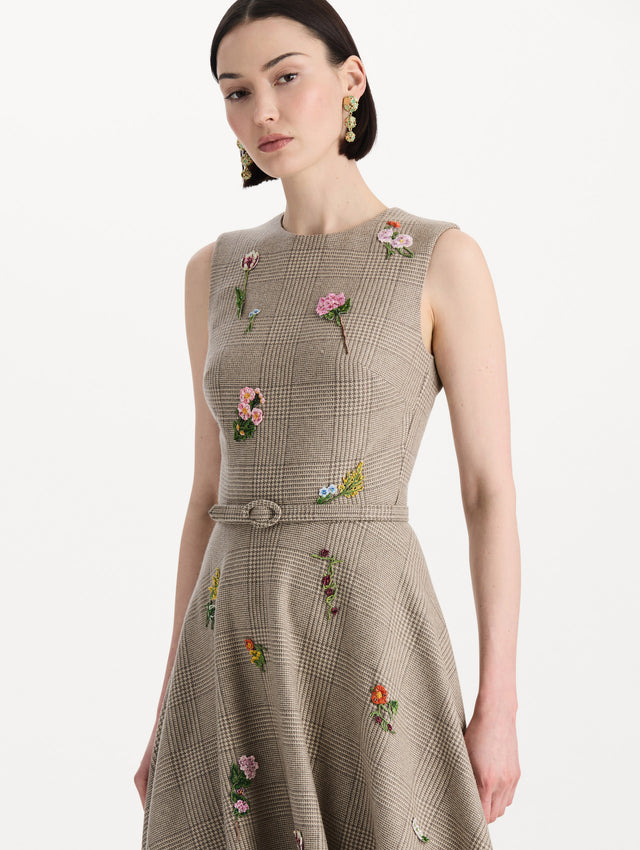 The model is wearing the plaid cashmere-blend dress with a sleeveless silhouette and a glen plaid pattern. Zoom view.