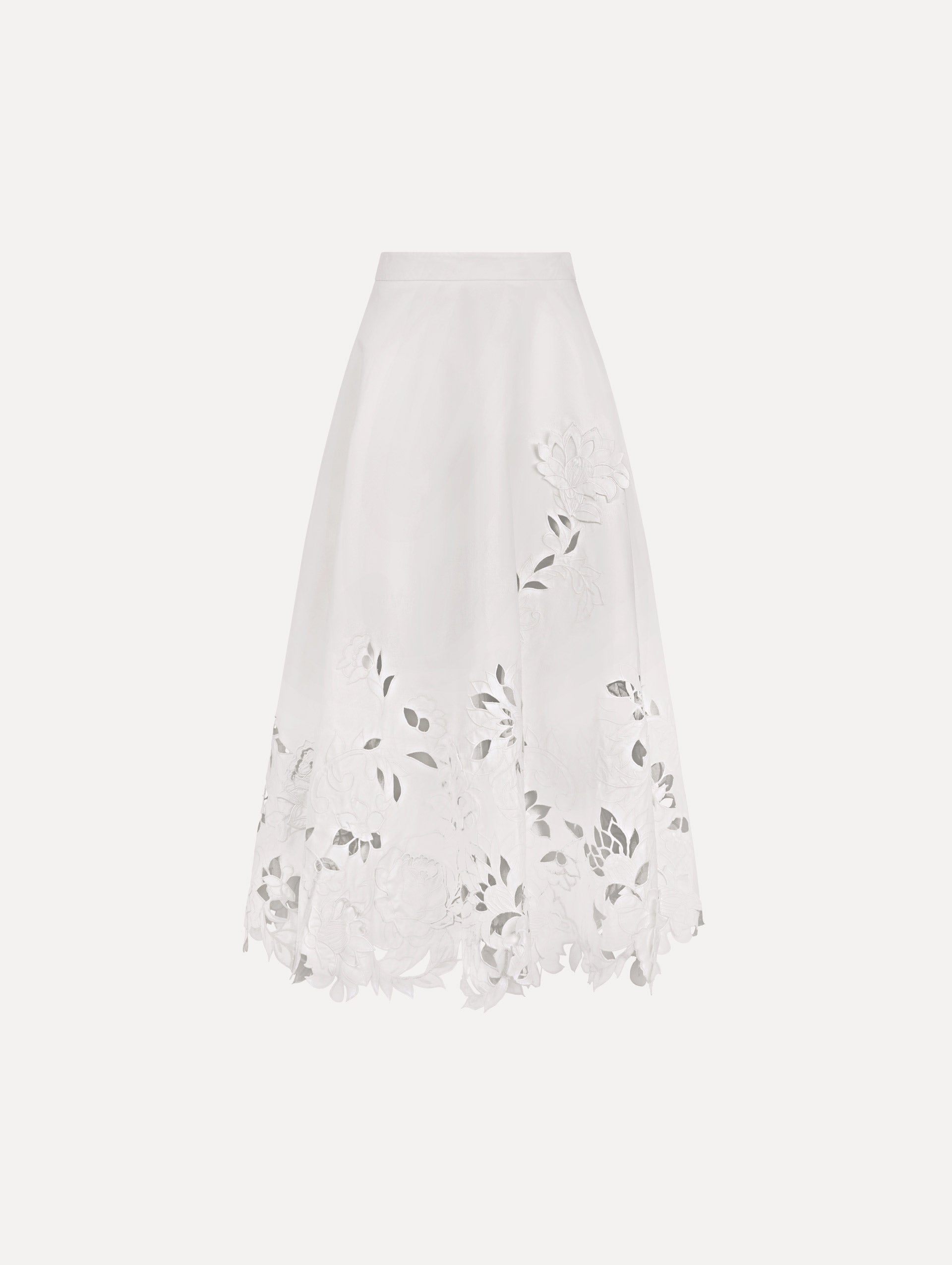 The model is wearing the floral cutout cotton twill skirt with botanical embroidery and a full silhouette in the color white.