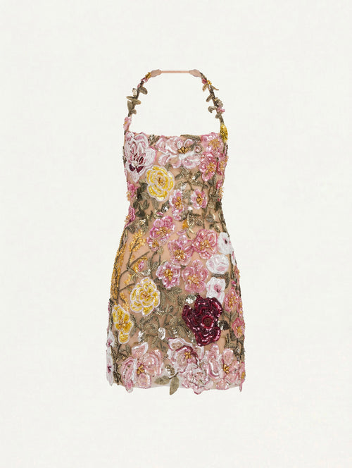 The model is wearing the beaded mixed botanical embroidered cocktail dress with a halter neckline in a multi-color palette.